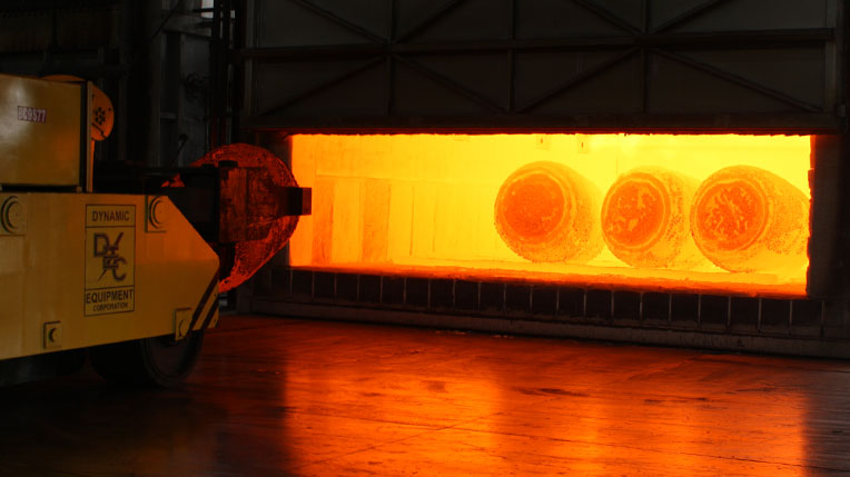 Press Forge furnace with glowing titanium discs